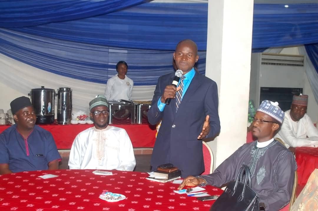 Abimbola speaking at a community gathering in Nigeria