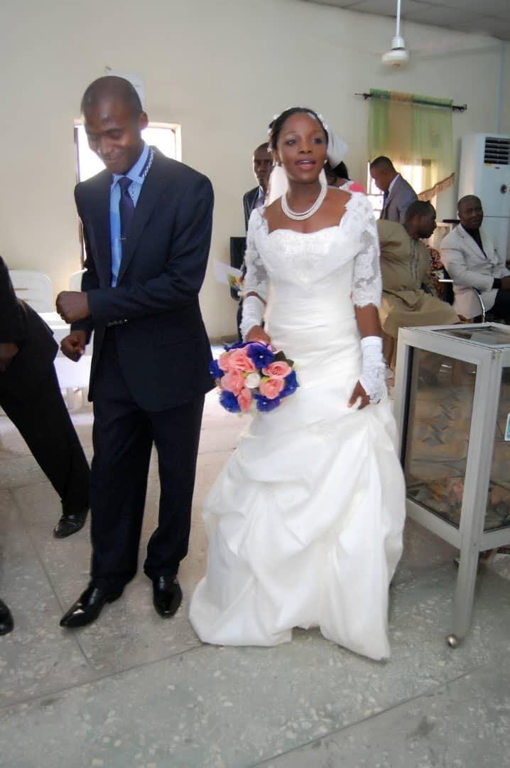 Abimbola and his wife on their wedding day